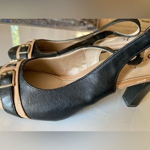 Black and tan sling back heels.